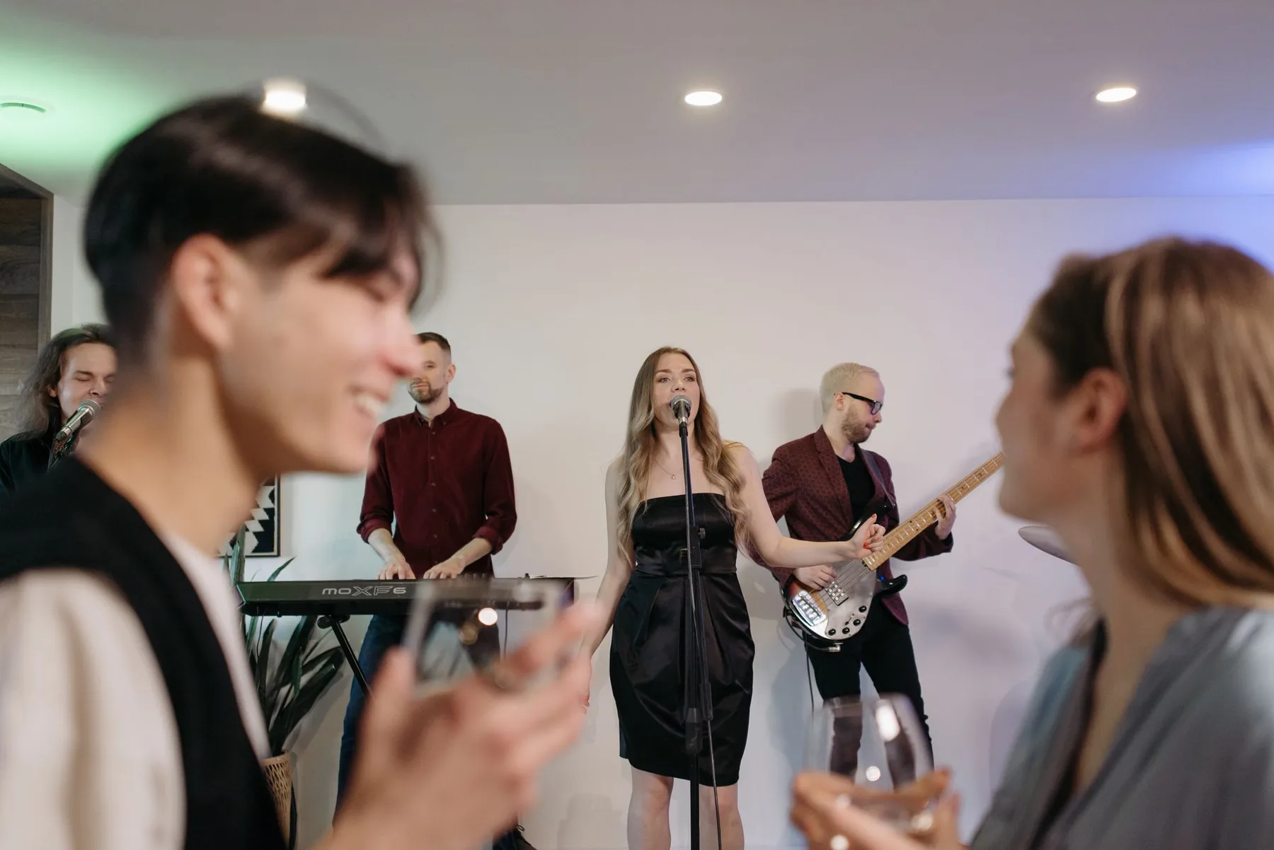 Friends singing at a party Friends singing at a party