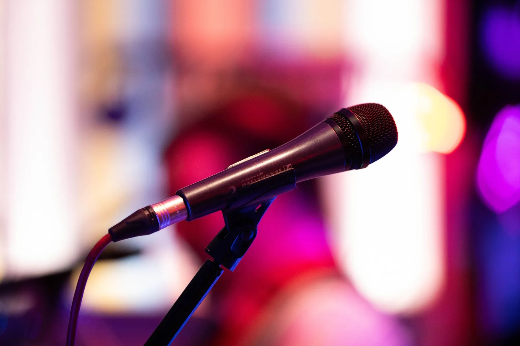 karaoke microphone in front of a bright screen karaoke microphone in front of a bright screen