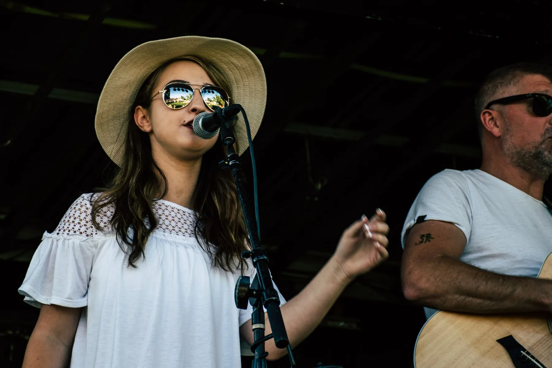 Singer on stage in front of a microphone Singer on stage in front of a microphone